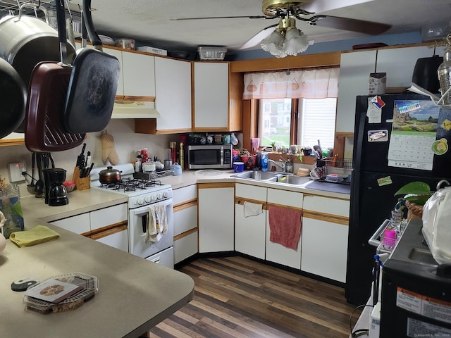 267 Chapman St, New Britain, CT 06051 - kitchen featuring white range with gas cooktop, stainless steel microwave, under cabinet range hood, ceiling fan, and light countertops