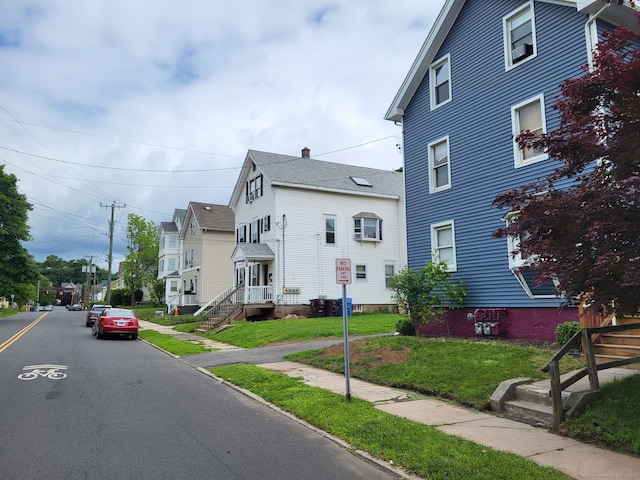 267 Chapman St, New Britain, CT 06051 - view of property exterior with a lawn
