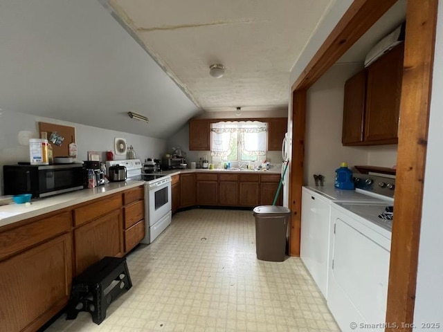 267 Chapman St, New Britain, CT 06051 - kitchen with independent washer and dryer, white range with electric cooktop, light flooring, lofted ceiling, and light countertops