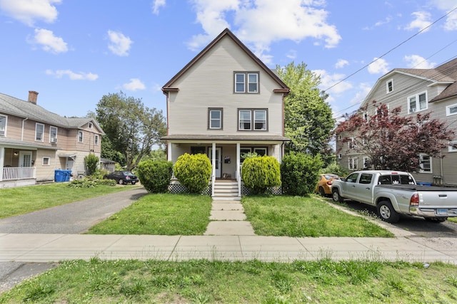 116 Divinity St, Bristol, CT 06010 - view of front facade featuring covered porch and a front yard