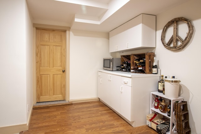 17 Kathleen Dr, Stratford, CT 06614 - bar featuring light wood finished floors and stainless steel microwave
