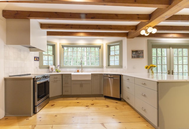 17 Kathleen Dr, Stratford, CT 06614 - kitchen featuring stainless steel appliances, gray cabinetry, plenty of natural light, a peninsula, and beamed ceiling