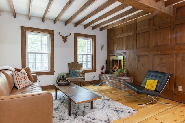 17 Kathleen Dr, Stratford, CT 06614 - living room featuring beamed ceiling, wood finished floors, and a fireplace