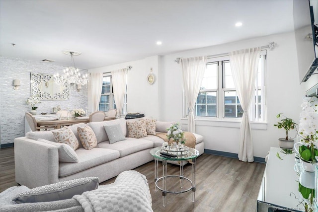 59 Courtland Ave Apt 3Q, Stamford, CT 06902 - living area featuring healthy amount of natural light, wood finished floors, a chandelier, an accent wall, and recessed lighting