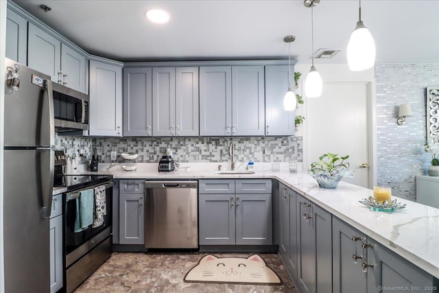 59 Courtland Ave Apt 3Q, Stamford, CT 06902 - kitchen featuring appliances with stainless steel finishes, gray cabinets, light stone counters, and tasteful backsplash