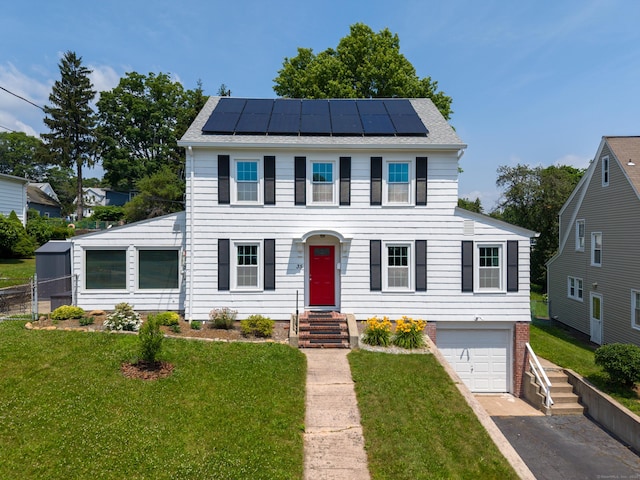 35 Brower St, West Haven, CT 06516 - colonial home featuring solar panels, driveway, and a garage