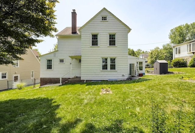 35 Brower St, West Haven, CT 06516 - rear view of house with a storage unit and a chimney