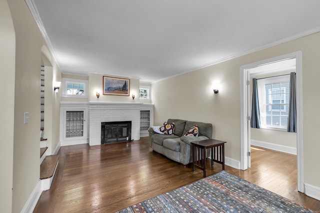 35 Brower St, West Haven, CT 06516 - living area with crown molding, hardwood / wood-style flooring, and a brick fireplace