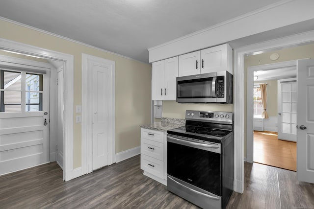 35 Brower St, West Haven, CT 06516 - kitchen featuring appliances with stainless steel finishes, dark wood-style floors, crown molding, white cabinetry, and light stone countertops