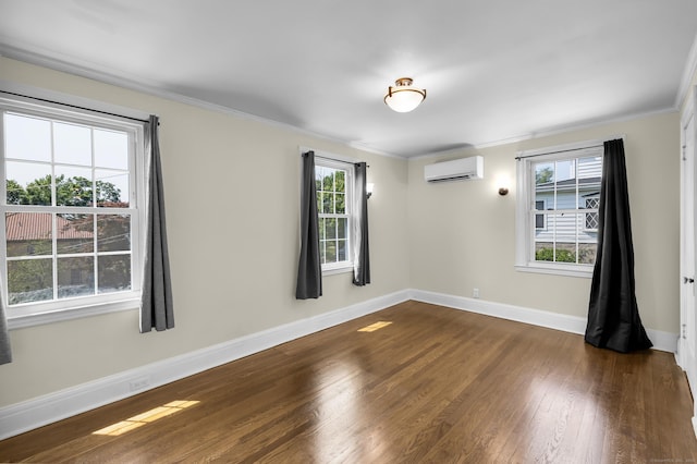 35 Brower St, West Haven, CT 06516 - empty room with an AC wall unit, dark wood-type flooring, and crown molding