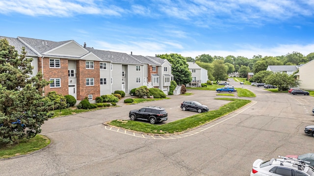 59 Carriage Dr Unit 59, Milford, CT 06460 - view of property featuring a residential view and uncovered parking
