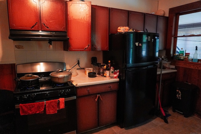 228 Elm St, Meriden, CT 06450 - kitchen featuring black appliances, under cabinet range hood, light countertops, and backsplash