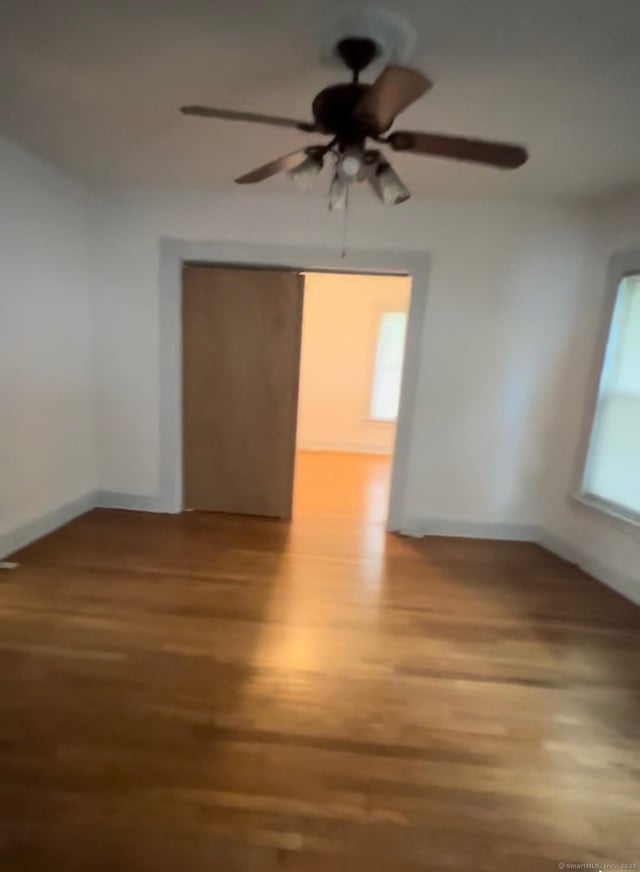 228 Elm St, Meriden, CT 06450 - unfurnished room featuring wood finished floors and ceiling fan