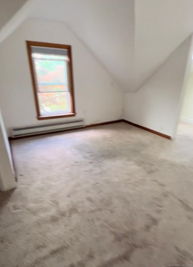 228 Elm St, Meriden, CT 06450 - bonus room with baseboard heating, lofted ceiling, and carpet