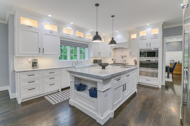 319 Mountain Rd, Wilton, CT 06897 - kitchen with a warming drawer, stainless steel oven, white cabinetry, a center island with sink, and open shelves