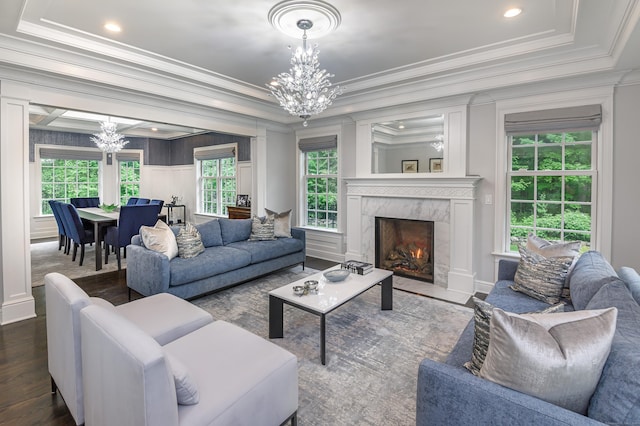 319 Mountain Rd, Wilton, CT 06897 - living area featuring a chandelier, ornamental molding, dark wood-style floors, a fireplace, and a tray ceiling