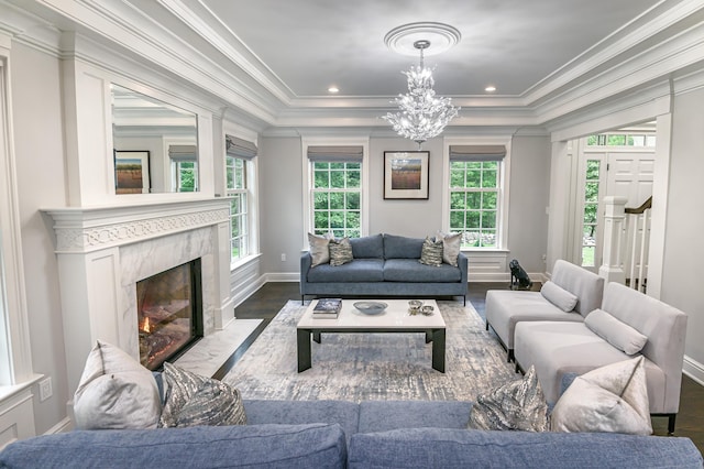 319 Mountain Rd, Wilton, CT 06897 - living area featuring plenty of natural light, crown molding, a chandelier, a tray ceiling, and wood finished floors