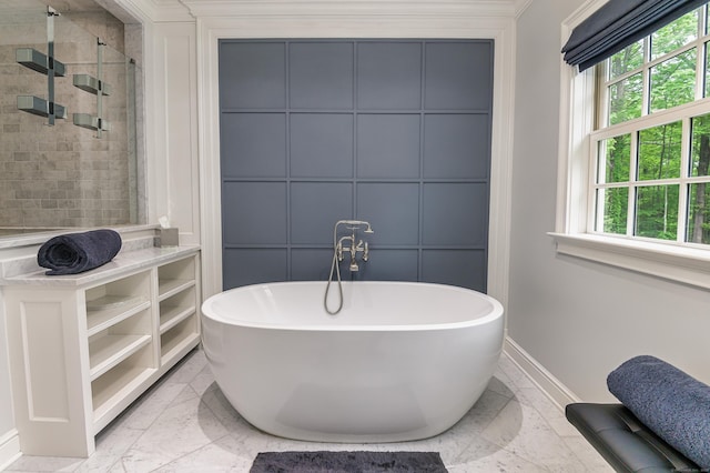 319 Mountain Rd, Wilton, CT 06897 - bathroom featuring plenty of natural light, a freestanding tub, a stall shower, marble look tiles, and a decorative wall