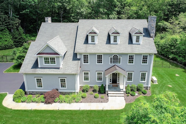 319 Mountain Rd, Wilton, CT 06897 - view of front of house featuring a chimney and roof with shingles