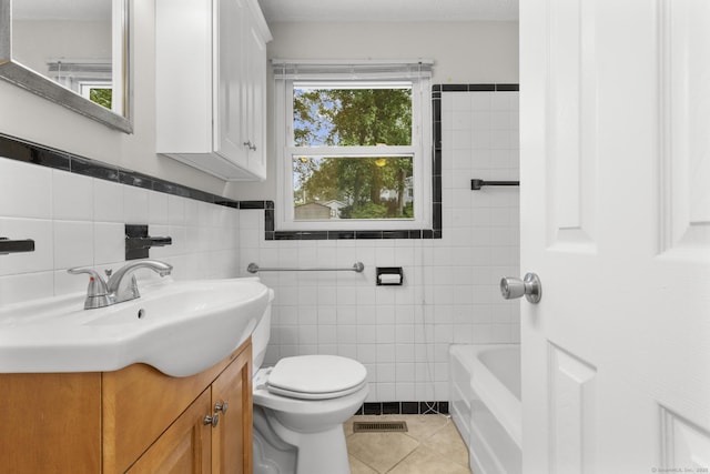 80 Holly St, Milford, CT 06460 - bathroom featuring tile walls, vanity, and tile patterned floors