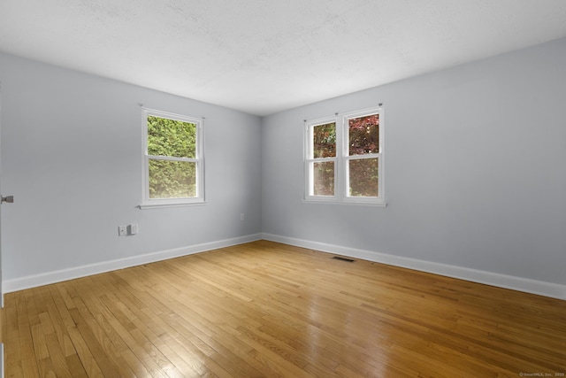 80 Holly St, Milford, CT 06460 - unfurnished room with light wood-type flooring and baseboards
