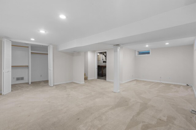 80 Holly St, Milford, CT 06460 - finished below grade area featuring light carpet and recessed lighting