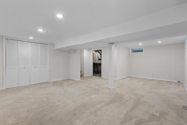80 Holly St, Milford, CT 06460 - finished below grade area with light carpet and recessed lighting