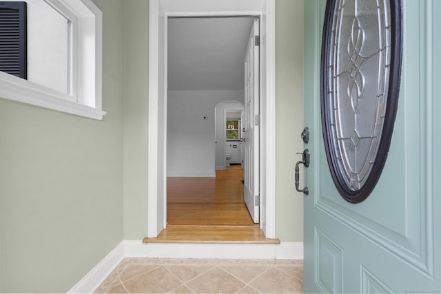 80 Holly St, Milford, CT 06460 - foyer with arched walkways and tile patterned flooring