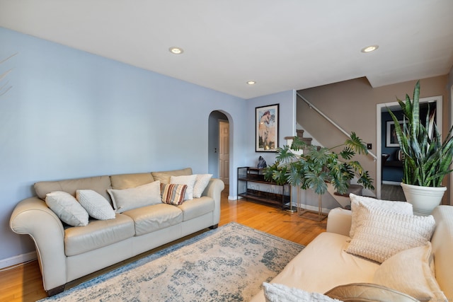 53 Daytona St, West Haven, CT 06516 - living room featuring arched walkways, stairs, wood finished floors, and recessed lighting