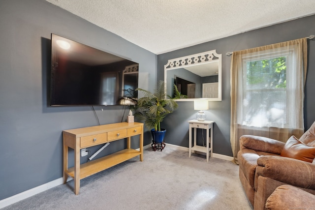 53 Daytona St, West Haven, CT 06516 - carpeted living area with baseboards and a textured ceiling