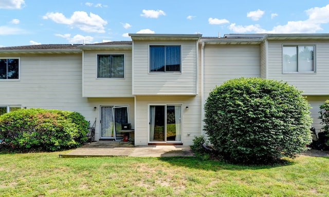 410 Emmett St Unit 45, Bristol, CT 06010 - rear view of property featuring a patio area and a lawn