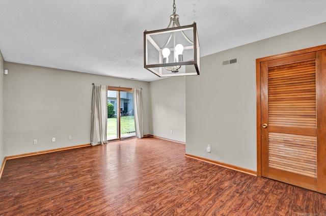 410 Emmett St Unit 45, Bristol, CT 06010 - empty room featuring a chandelier, wood finished floors, and a textured ceiling