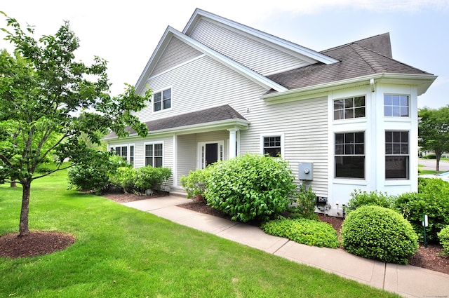 20 Carnoustie Cir, Bloomfield, CT 06002 - rear view of house featuring a yard and a shingled roof
