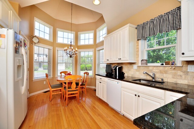 20 Carnoustie Cir, Bloomfield, CT 06002 - kitchen with white appliances, light wood finished floors, a chandelier, pendant lighting, and white cabinetry