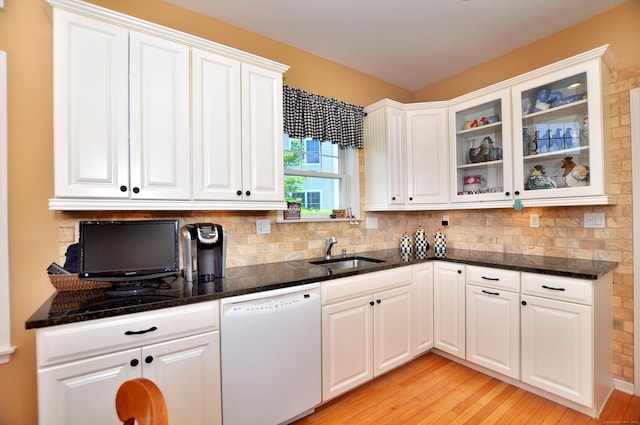 20 Carnoustie Cir, Bloomfield, CT 06002 - kitchen with white dishwasher, light wood-style flooring, tasteful backsplash, white cabinets, and dark stone counters