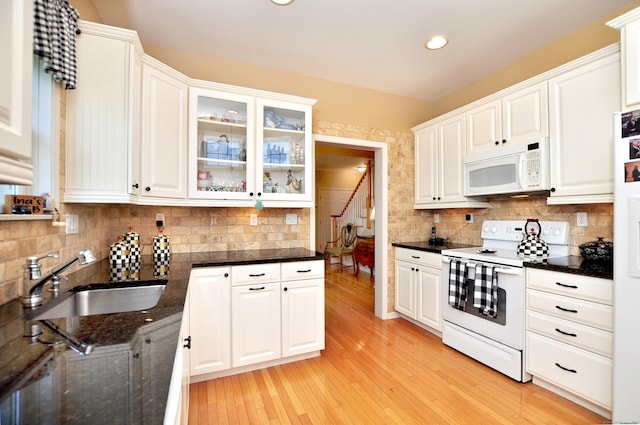 20 Carnoustie Cir, Bloomfield, CT 06002 - kitchen featuring white appliances, white cabinets, decorative backsplash, glass insert cabinets, and recessed lighting