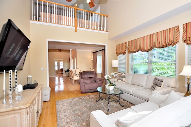 20 Carnoustie Cir, Bloomfield, CT 06002 - living room featuring light wood-type flooring, a ceiling fan, and a towering ceiling