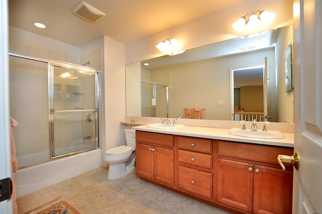 20 Carnoustie Cir, Bloomfield, CT 06002 - full bathroom featuring bath / shower combo with glass door, double vanity, and tile patterned flooring