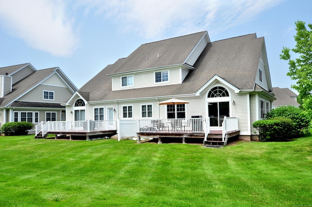 20 Carnoustie Cir, Bloomfield, CT 06002 - back of house featuring a deck, a lawn, and roof with shingles