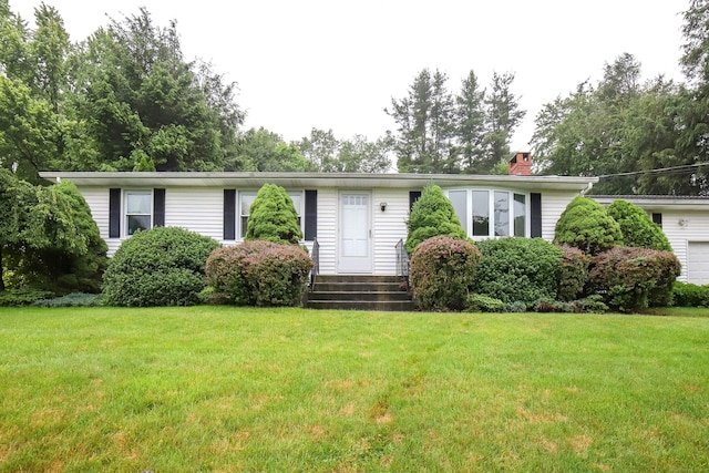 57 Apple Tree Ln, Hamden, CT 06518 - single story home featuring a chimney, a front lawn, and a garage