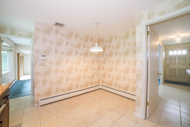 57 Apple Tree Ln, Hamden, CT 06518 - empty room featuring wallpapered walls, a baseboard heating unit, healthy amount of natural light, and light tile patterned flooring