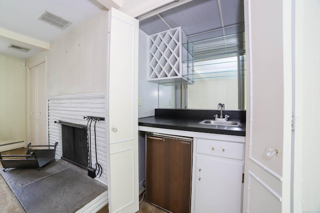 57 Apple Tree Ln, Hamden, CT 06518 - indoor wet bar featuring a fireplace, refrigerator, and a baseboard radiator