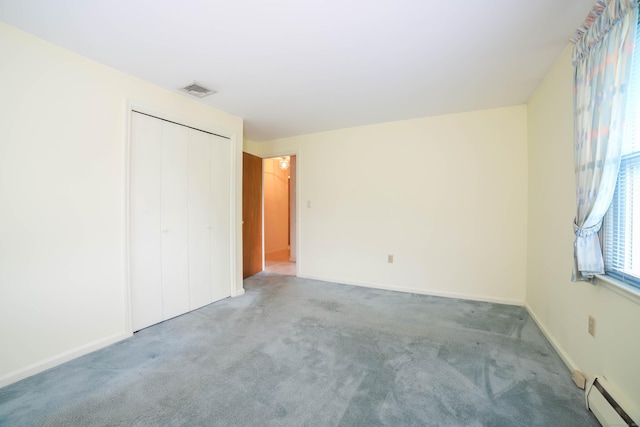57 Apple Tree Ln, Hamden, CT 06518 - unfurnished bedroom with baseboard heating, carpet, and a closet