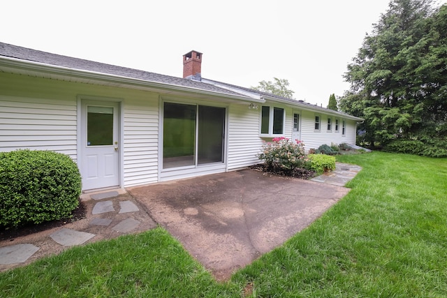 57 Apple Tree Ln, Hamden, CT 06518 - rear view of property featuring a lawn, a chimney, and a patio