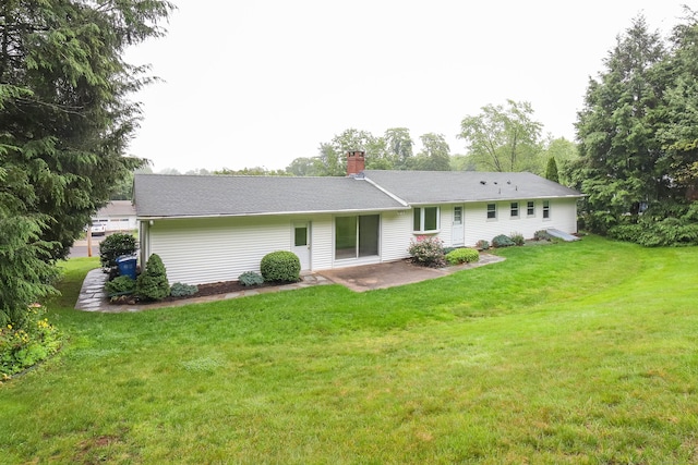 57 Apple Tree Ln, Hamden, CT 06518 - back of property featuring a patio area, a lawn, and a chimney