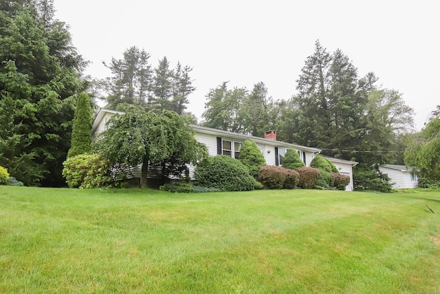 57 Apple Tree Ln, Hamden, CT 06518 - view of front facade with a chimney and a front yard