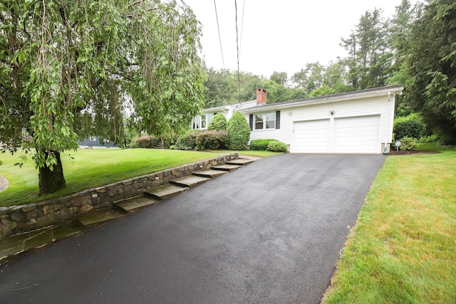 57 Apple Tree Ln, Hamden, CT 06518 - ranch-style house with driveway, an attached garage, a front lawn, and a chimney