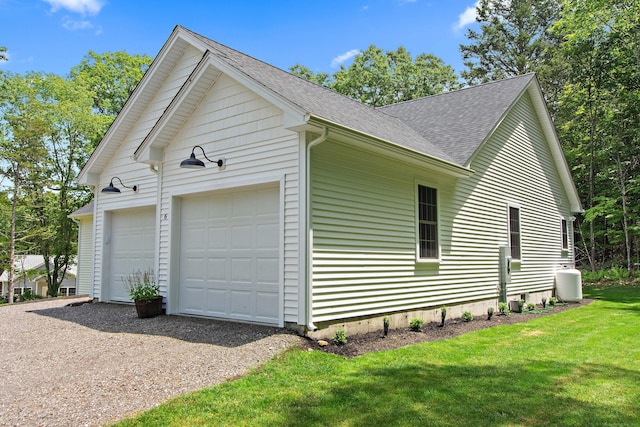 6 S Bear Hill Rd, Chaplin, CT 06235 - view of side of home with a shingled roof, a yard, and a garage