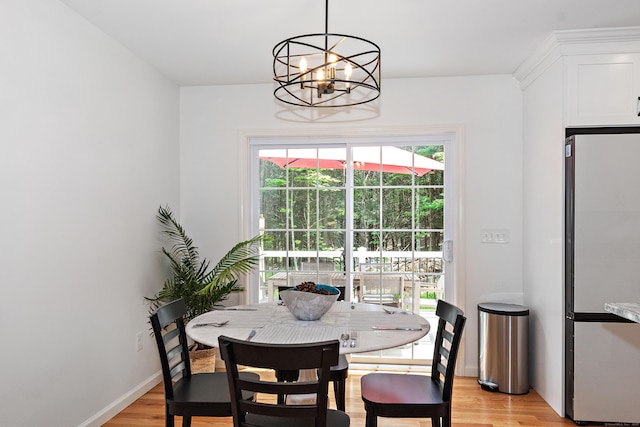 6 S Bear Hill Rd, Chaplin, CT 06235 - dining area featuring a chandelier and light wood-style floors