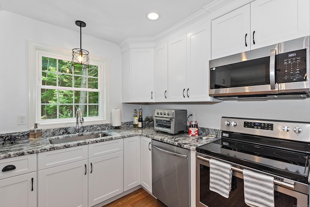 6 S Bear Hill Rd, Chaplin, CT 06235 - kitchen featuring appliances with stainless steel finishes, white cabinets, stone counters, decorative light fixtures, and recessed lighting